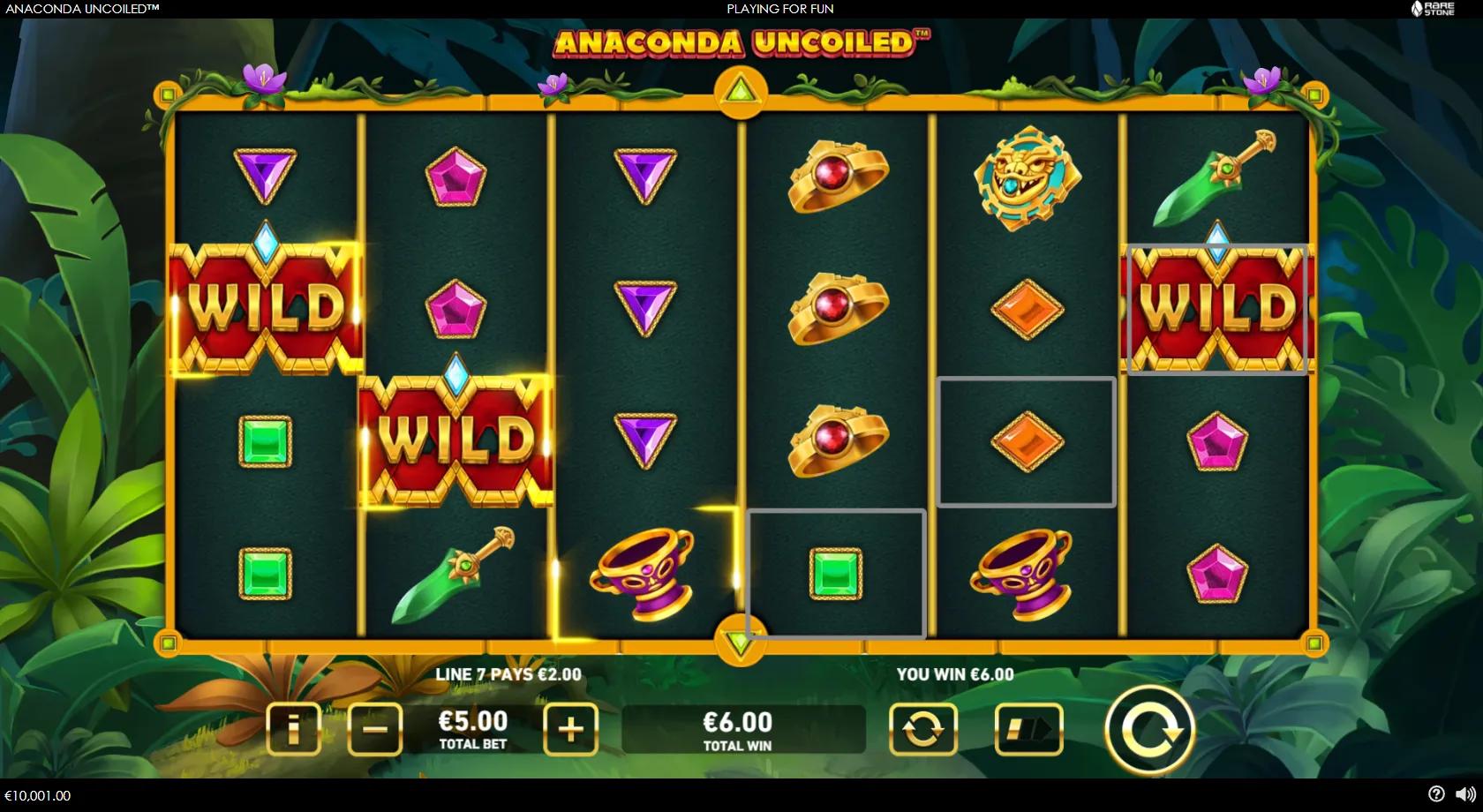 Anaconda Uncoiled gameplay showing 6x4 jungle-temple reels with Aztec priestess, gems and stacked WILD symbols