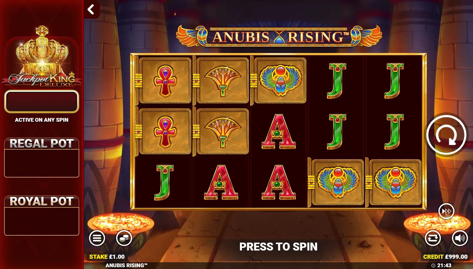Anubis Rising Jackpot King slot showing 5x3 Egyptian grid with expanding Wilds and Jackpot King pots panel