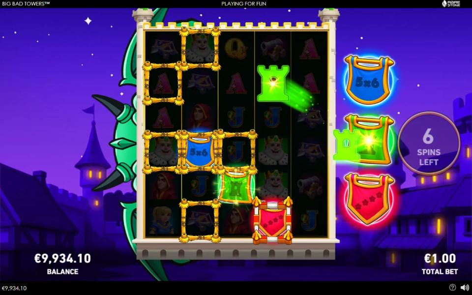 First free spin of the bought Big Bad Towers bonus on a six-row grid, with frames spread by the green flag and a red level-four frame on reel 4