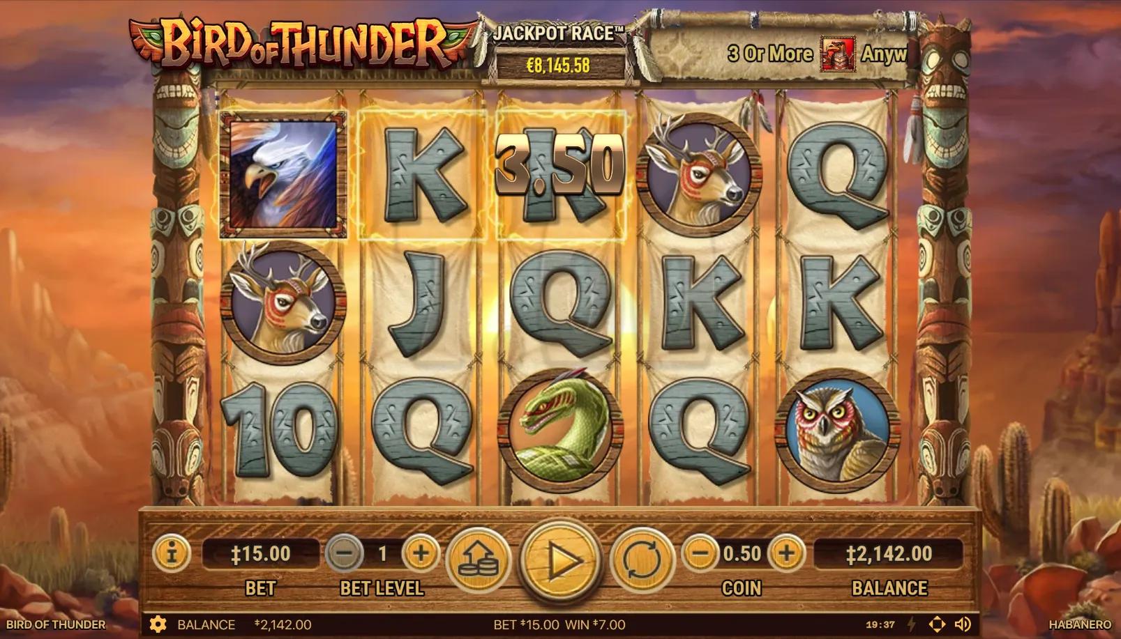 Bird of Thunder slot gameplay showing 5x3 grid with thunderbird, owl, deer, rattlesnake, and mountain dreamcatcher scatter framed by Native American totem poles in red-rock desert sunset