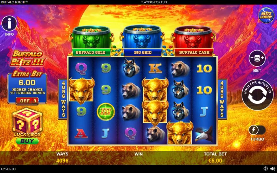 Buffalo Blitz 3 base game, 6x4 grid at 4096 ways with the green Buffalo Gold, blue Big Grid and red Buffalo Cash barrels lined up above the reels