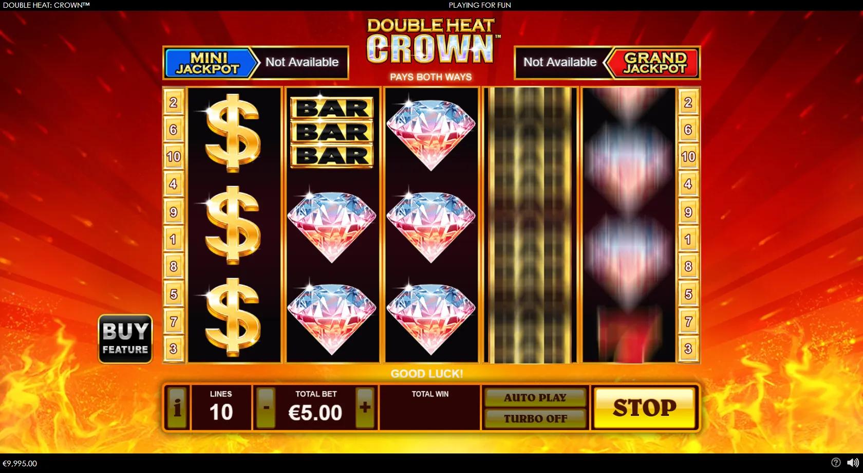 Double Heat Crown slot gameplay showing a fiery classic 5x3 grid with diamonds, gold dollar signs, red 7s, BAR blocks and a royal crown wild, plus Mini and Grand jackpots