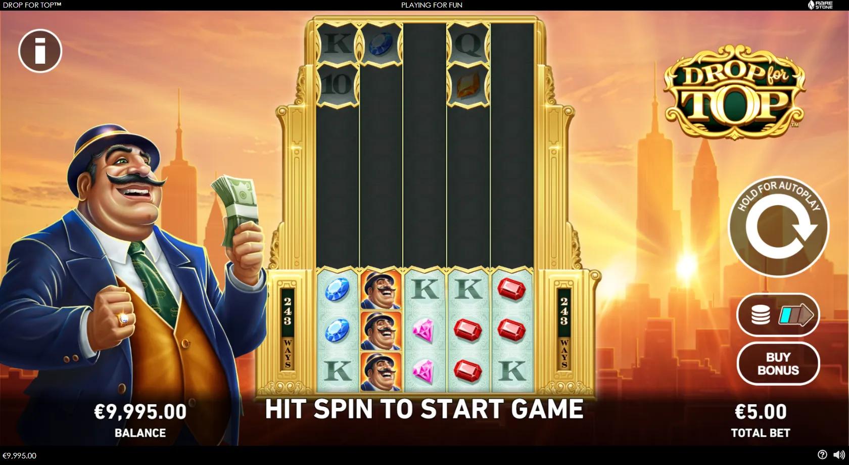 Drop for Top slot gameplay showing a golden Art-Deco skyscraper grid over a Manhattan skyline with gem and royal symbols, a rich tycoon and an expanding 243-ways frame