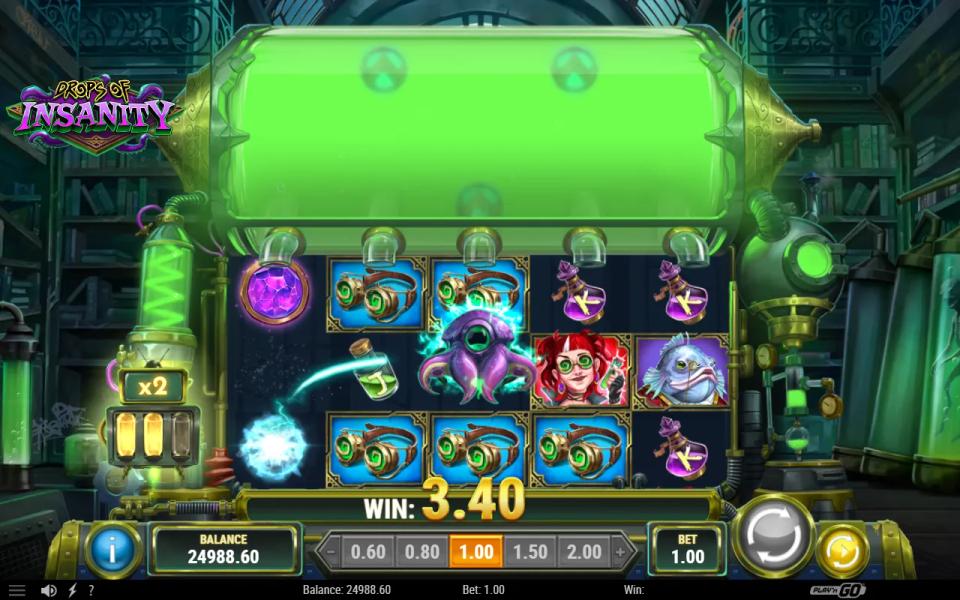 Drops of Insanity base game in a steampunk lab: a green tank above the 5x3 reels, a purple Scatter orb on reel 1 and the Spawn creature firing a bolt across reel 3, multiplier meter at x2