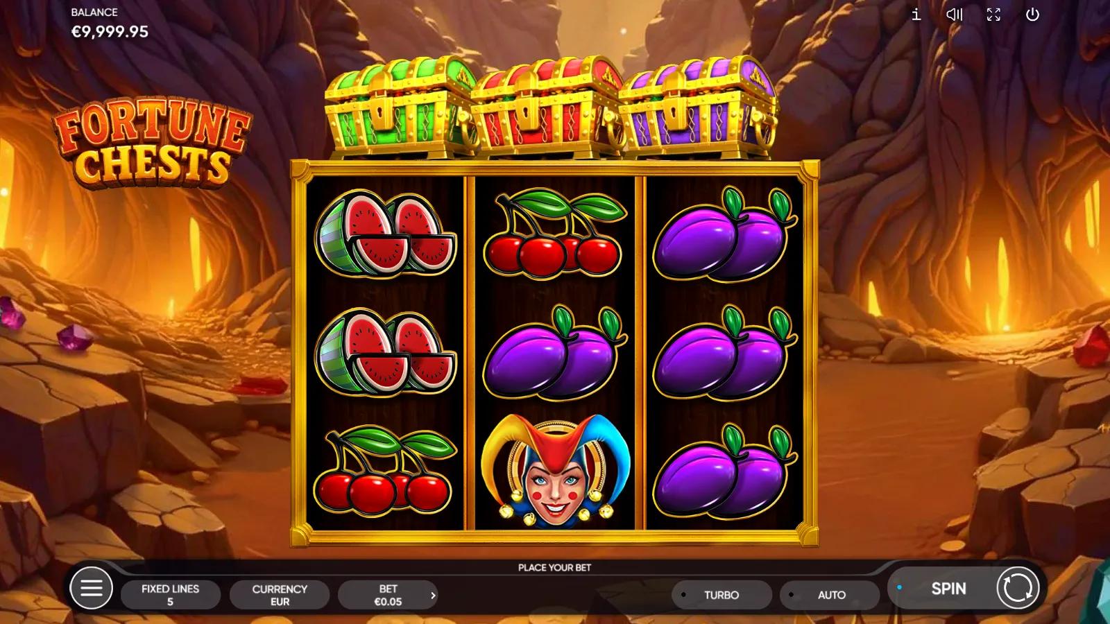 Fortune Chests gameplay showing 3x3 fruit reels with grapes, plums and a Joker beneath the green, red and purple chests