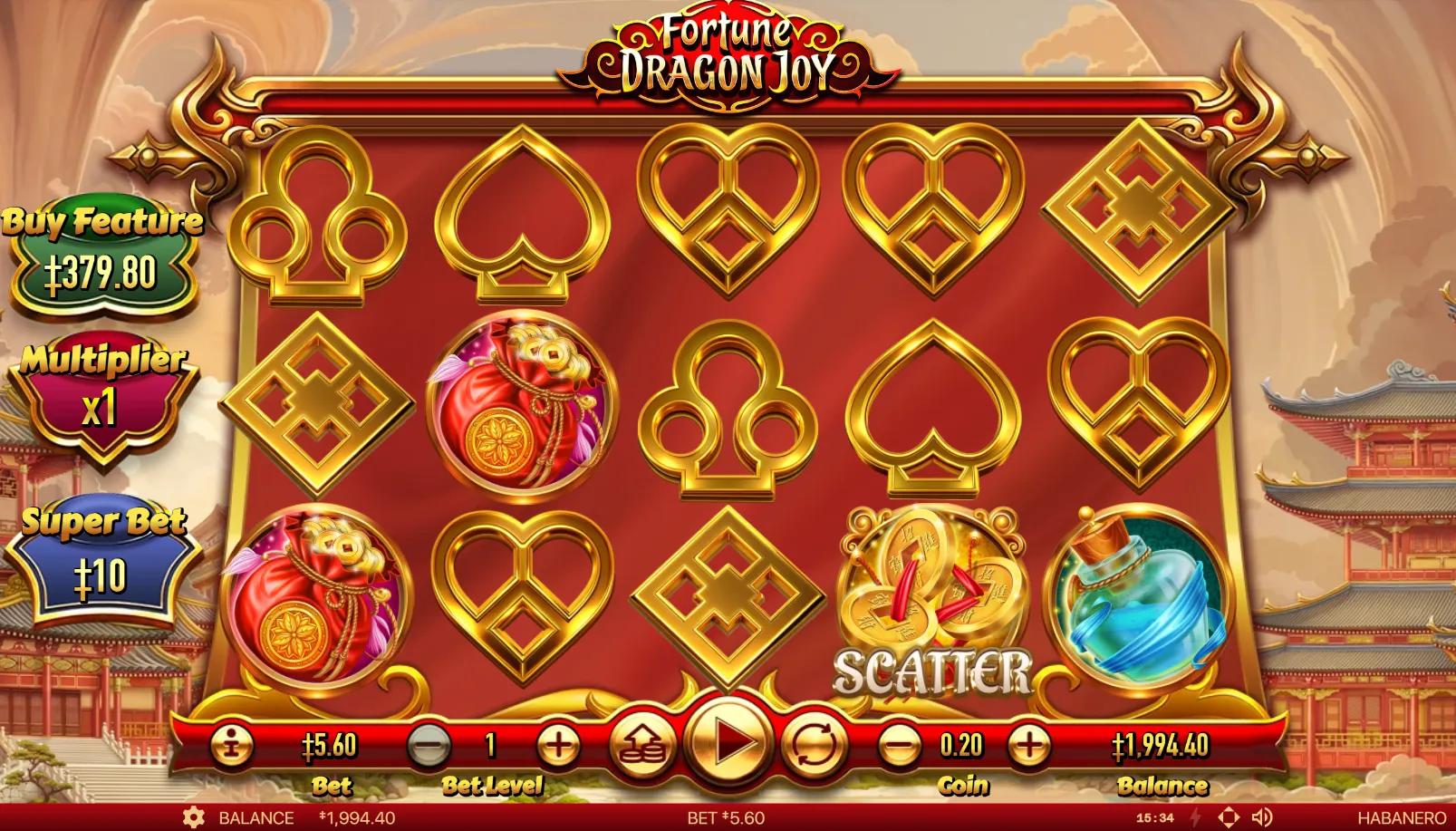 Fortune Dragon Joy slot gameplay showing 5x3 grid with Chinese-knot playing card symbols and Wheel of Fortune scatter