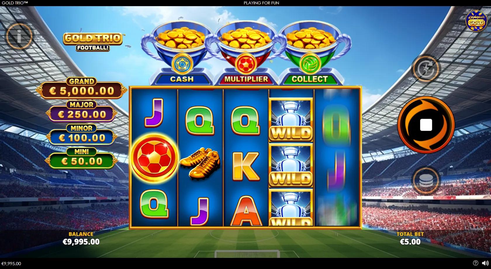 Gold Trio: Football! slot gameplay showing the 5x3 reels under three trophy pots in a floodlit night stadium, with blue, red and green gold coins locked during the Gold Trio Respins.
