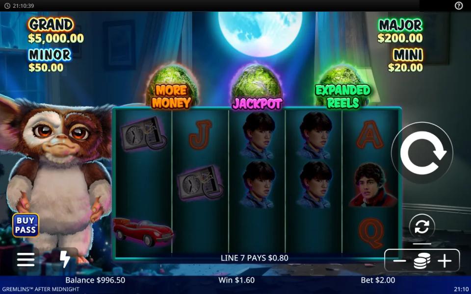 Gremlins After Midnight reels with the three green Mogwai eggs labelled More Money, Jackpot and Expanded Reels above them