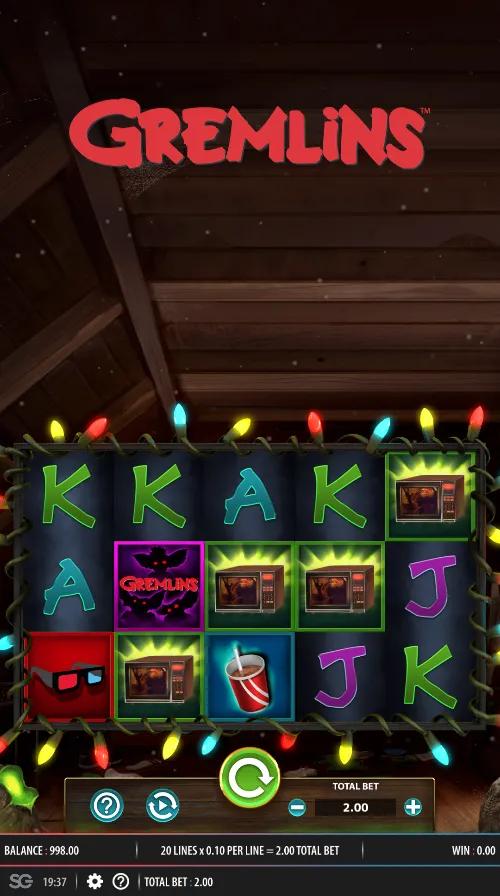 Gremlins slot 5x3 grid framed by fairy lights, with the microwave, Gizmo Bonus and green Wild symbols