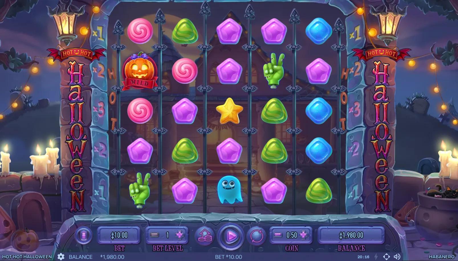 Hot Hot Halloween slot gameplay showing 5x5 candy-themed grid with lollipops, gummies, zombie hand, ghost, and pumpkin scatter symbols inside iron gate cabinet