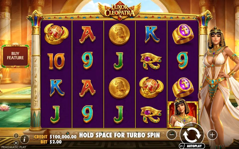 Luxor of Cleopatra base game, a 5x4 grid of Egyptian symbols and card ranks with the buy feature panel at the left