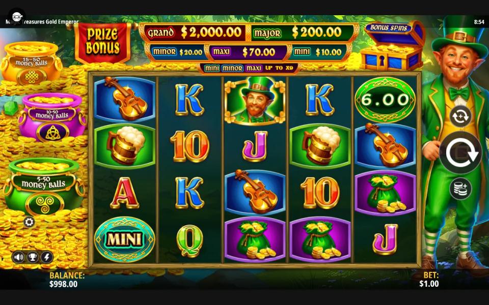 Magic Treasures Gold Enchanted Shamrock 5x4 reels with a Mini coin on reel 1, a 6.00 money ball on reel 5, the jackpot panel above and three money ball pots on the left