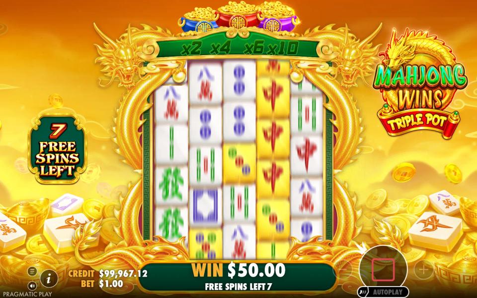 The first free spin of Mahjong Wins Triple Pot with the win box already showing fifty dollars from the triggering coin