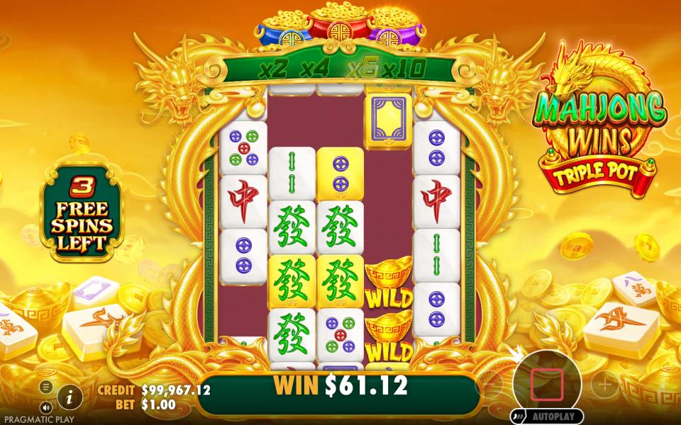A gold-marked active reel in the Mahjong Wins Triple Pot free spins with two ingot wilds on it and the feature trail lit at x4