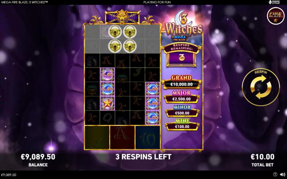Mega Fire Blaze 3 Witches hold and respin board expanded to seven rows with the top two still sealed by padlocks, three witch reels below the grid and the chained Grand reel above it