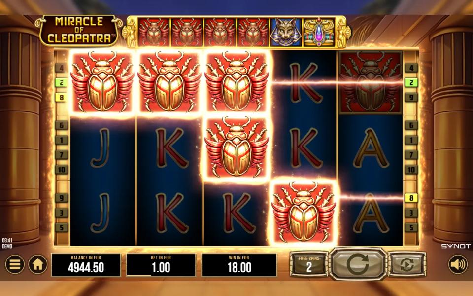 Miracle of Cleopatra free spins: golden scarab symbols lit up across a winning line on the 5x3 reels, with the upgrade bar above showing four scarabs, a cat and a crown