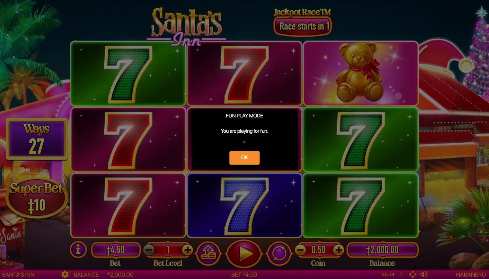 Santa's Inn slot showing 3x3 grid of varicolored 7s and a teddy bear premium with Jackpot Race counter overhead