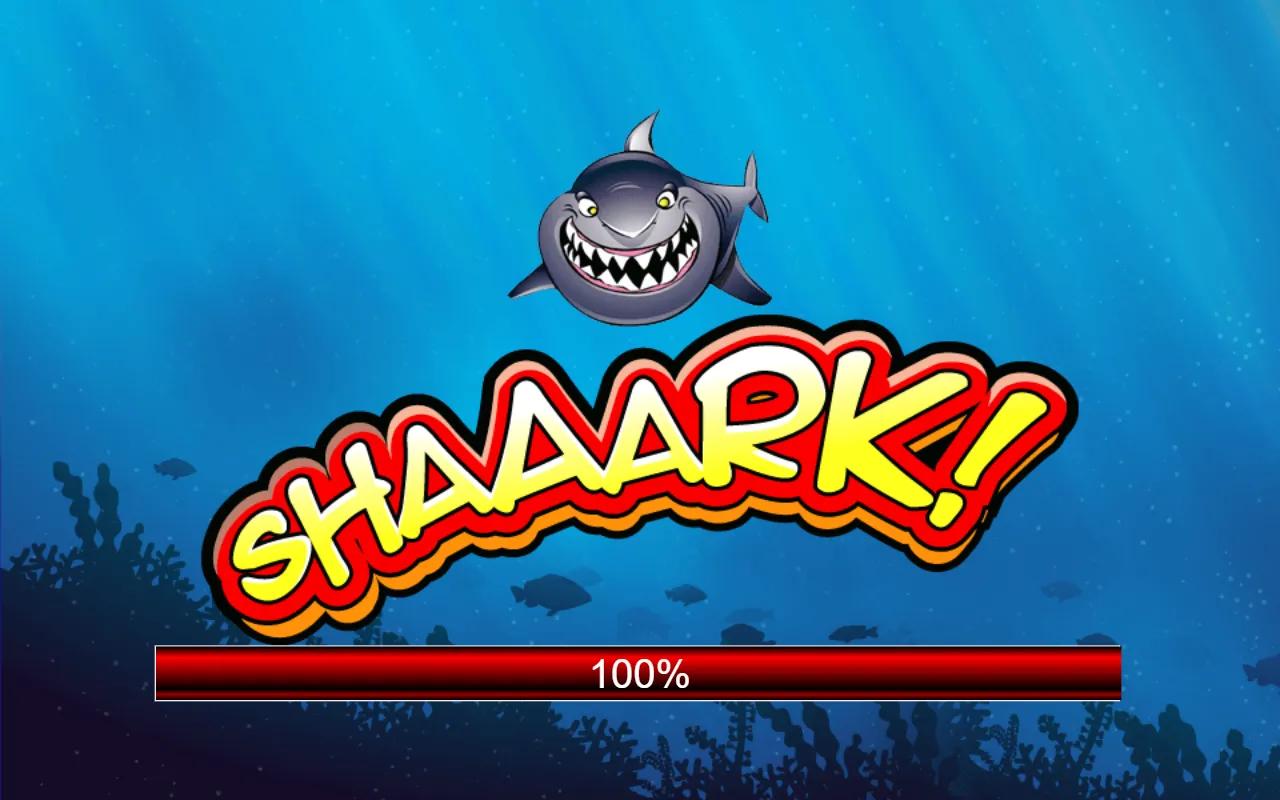 Shaaark slot loading splash showing the cartoon great white shark above the underwater 5x3 reels logo