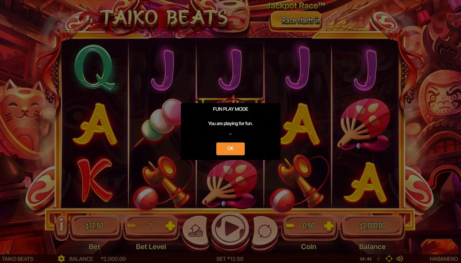 Taiko Beats slot gameplay showing 5x3 grid with pagoda scatter symbol and red folding fan on the middle reel