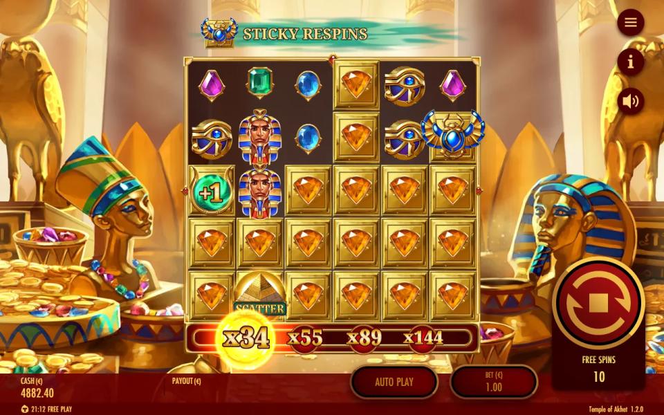 Temple of Akhet free spin with Sticky Respins running: most of the 6x5 board locked as gold-framed orange gems, a Golden Scarab Wild and a +1 Sun Disc among them, the multiplier ladder lit at x34