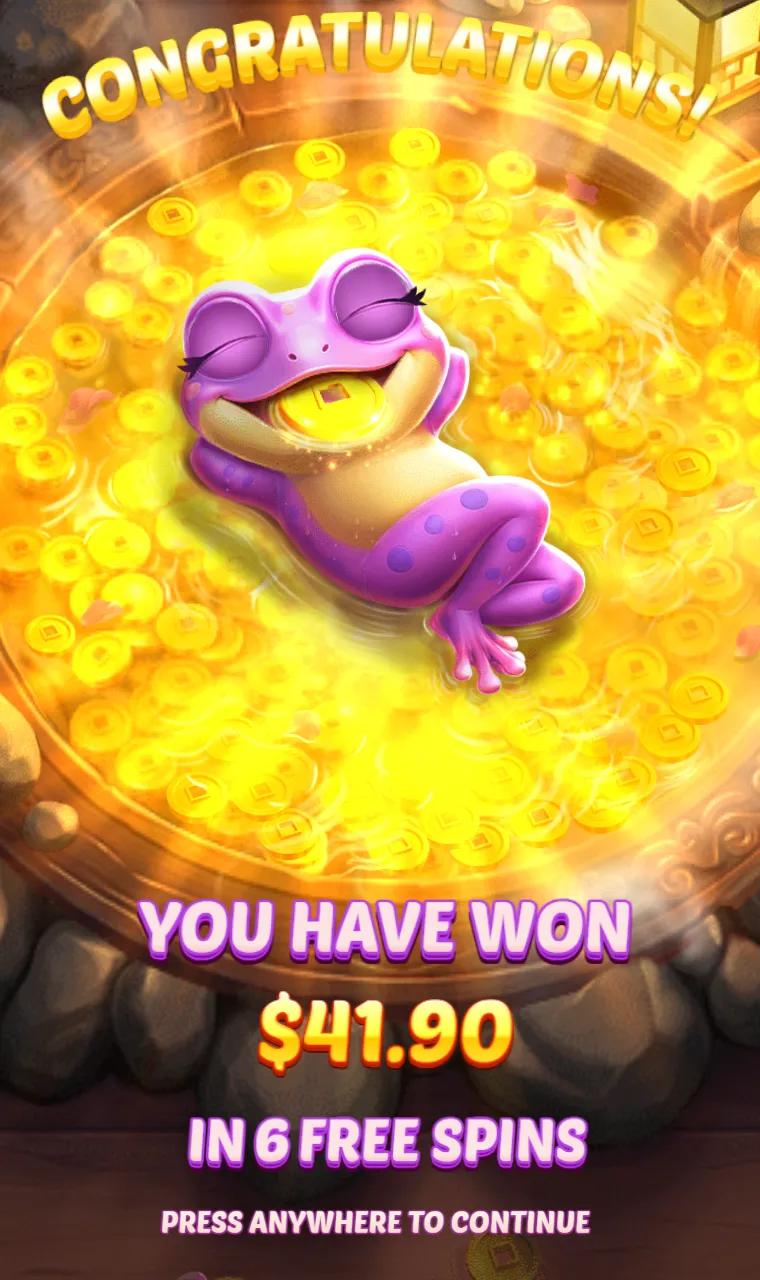 End card of the free spins with the round's total, the purple frog sitting in a pot of coins