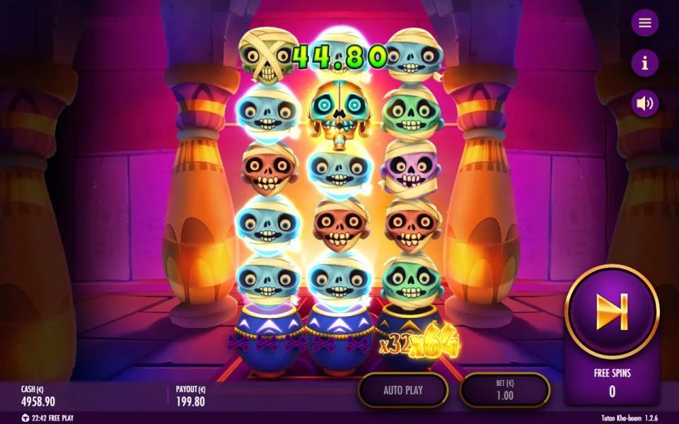 Tutan Kha-boom bonus board of blue and green mummies with a 44.80 win label and x64 lit after 15 wilds