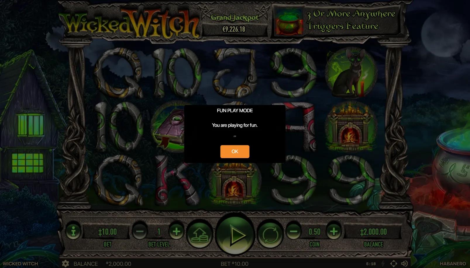 Wicked Witch slot gameplay showing 5x3 grid with black cat, fireplace and grimoire symbols on a gothic witch-lair backdrop