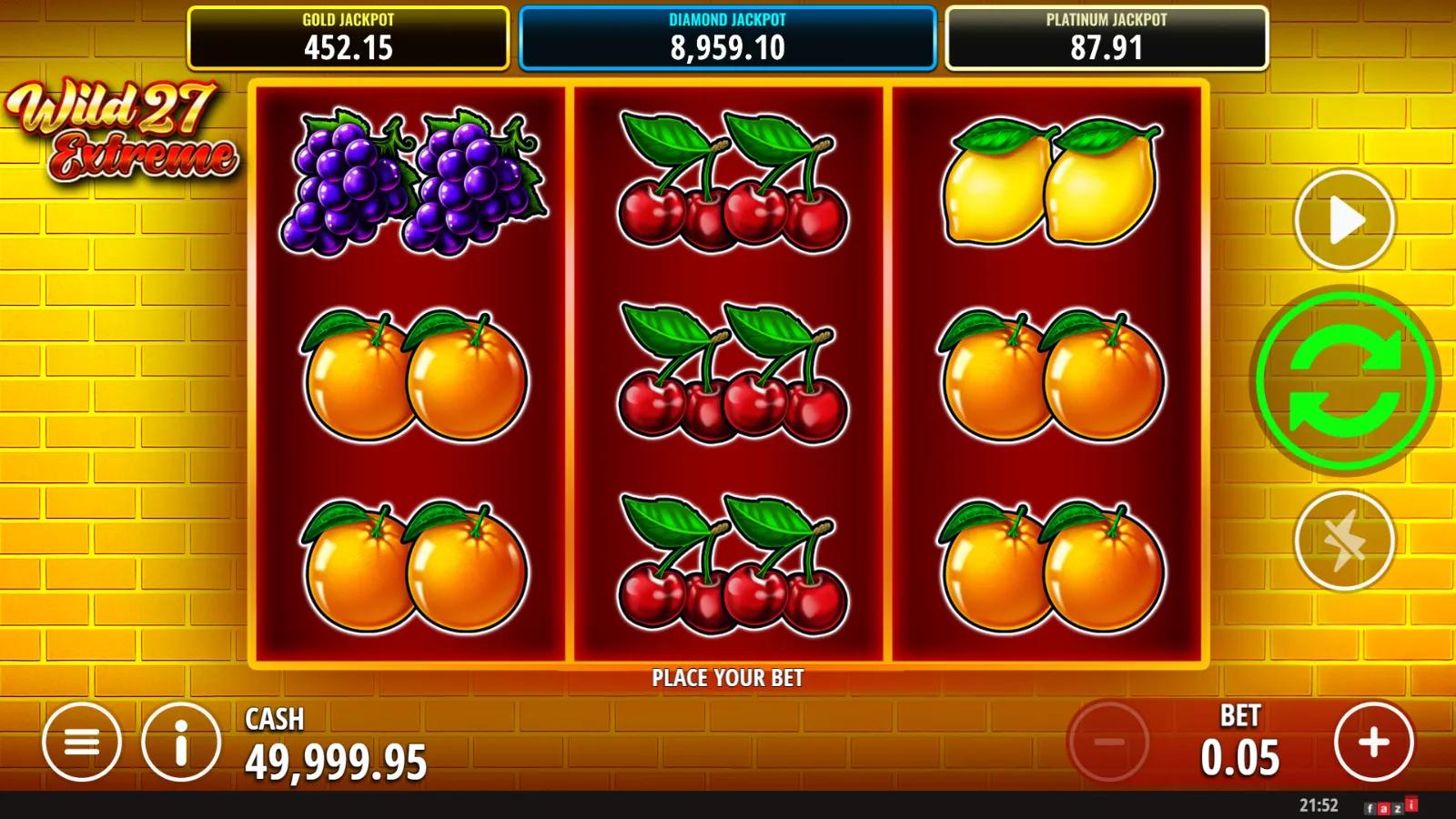 Wild 27 Extreme slot gameplay showing 3x3 fruit reels with paired oranges, cherries and Gold, Diamond, Platinum jackpots